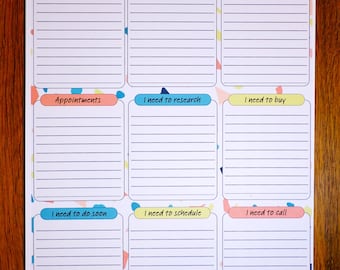 May include: A white Daily Brain Dump notepad with lined sections for notes. The notepad has colorful headers like "I need to do today," "Appointments," and "I need to call." The top has the text "Daily Brain Dump" and a space for the date.