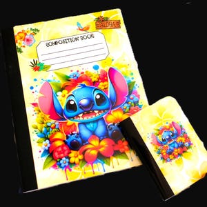 May include: A composition book and a smaller matching notebook featuring a blue alien character surrounded by colorful tropical flowers and green leaves. The composition book has a white label with the text COMPOSITION BOOK and a wooden sign reading ALOHA.