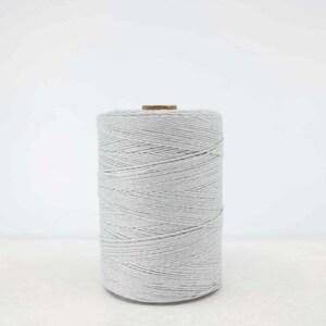 May include: A spool of light gray cotton twine.