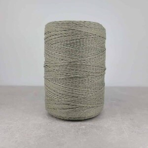 May include: A spool of light green yarn.