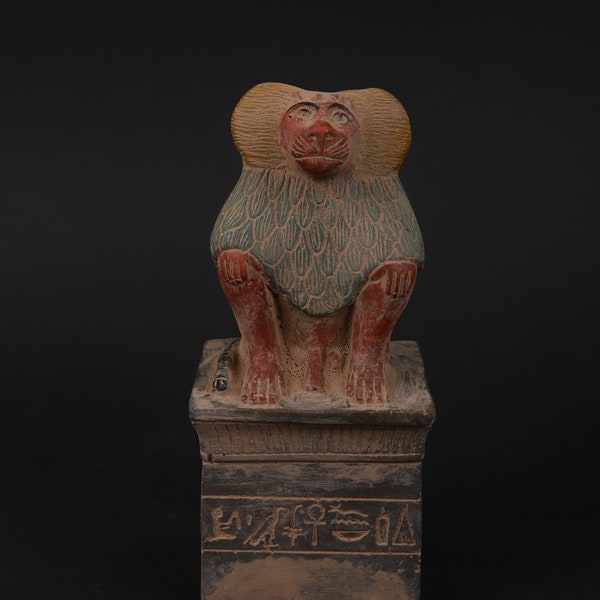 Statue of Thoth as a seated Baboon wearing featherd Thoth was the Symbol of Wisdom, the moonand Time made of heavy stone