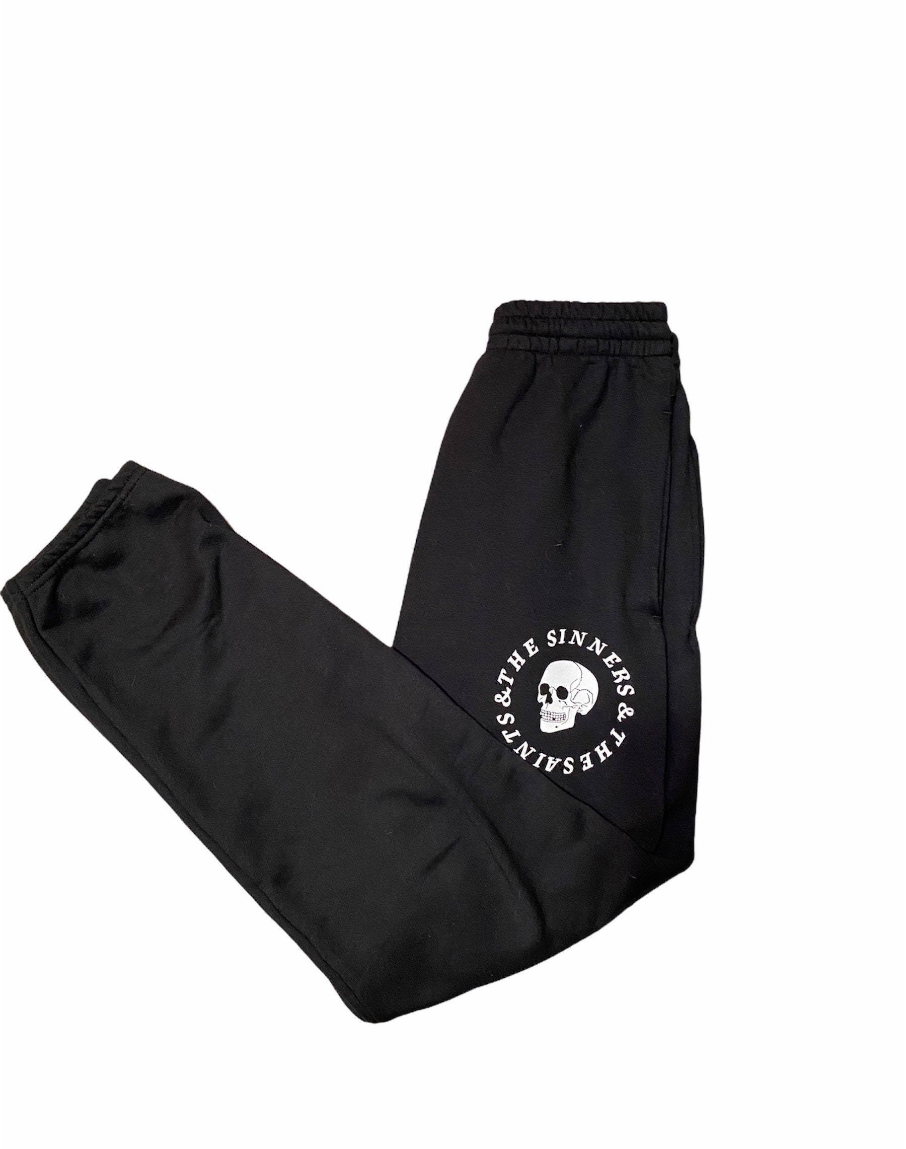 white sweatpants with black stripe
