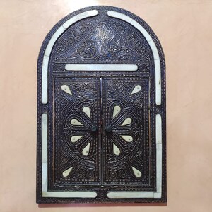 wooden mirror decorated with rubbed bone and metal threads