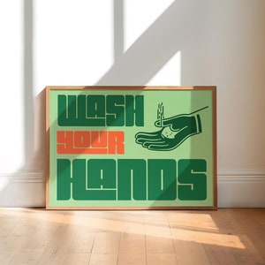May include: A green and orange poster with the text "Wash Your Hands" and a stylized illustration of a hand washing with soap.