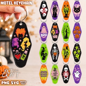 May include: A collection of diamond-shaped motel keychains featuring various Halloween-themed graphics including skeletons, ghosts, witches, pumpkins, and black cats in vibrant colors like orange, purple, green, and black with metal key rings.
