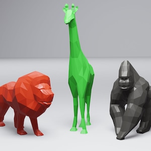 May include: Three low-poly animal figurines: a red lion, a green giraffe, and a black gorilla. The figurines are made of a textured material and have a geometric design.