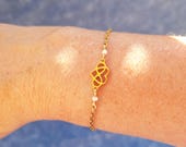 Bracelet chaîne dorée et cœur infini
