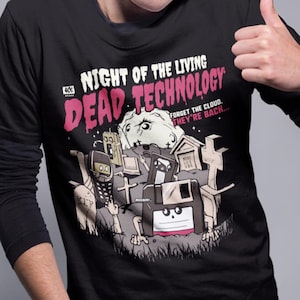 May include: A black long-sleeved t-shirt with a graphic print of a cartoon zombie-like computer with the text "Night of the Living Dead Technology" and "Forget the Cloud, They're Back!"