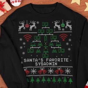 May include: Black Christmas sweater with a festive design featuring reindeer, snowflakes, bells, and Christmas trees. The sweater has a network-themed graphic with the text "SANTA'S FAVORITE SYSADMIN".