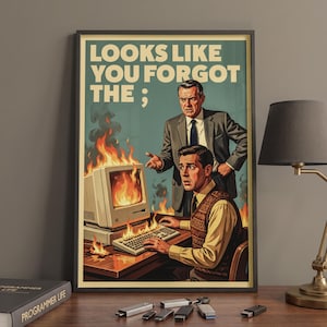 May include: A framed poster featuring a retro-style illustration of a person typing at a computer that is engulfed in flames, with another person standing behind them. The text at the top reads, "LOOKS LIKE YOU FORGOT THE ;" in bold, cream-colored letters.