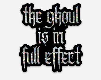 May include: Black and white sticker with the text "The ghoul is in full effect" in a gothic font.