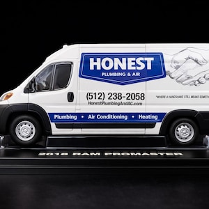May include: A white 2018 Ram Promaster van model with black accents. The van features the text "HONEST PLUMBING & AIR" in blue, along with a phone number and website. The side of the van has the words "Plumbing, Air Conditioning, Heating".