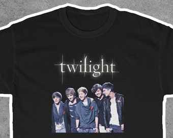 May include: Black t-shirt with a graphic of the four main characters from the Twilight movie series. The text "twilight" is printed in white above the image.