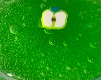 sour apple squeeze // crystal clear jelly texture slime with polymer clay green apple charm