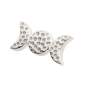 May include: Silver triple moon charm with a textured surface.