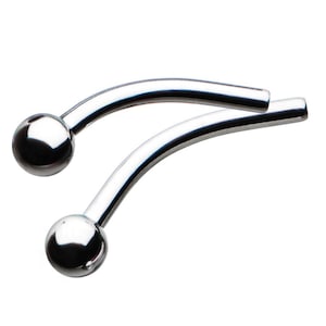 May include: Two silver curved barbell body jewelry pieces with ball ends.