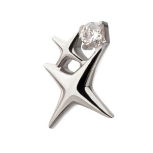 May include: A silver-toned metal pendant shaped like a stylized star with multiple pointed arms. The design features a single clear, round faceted gemstone set securely within the upper portion of the metallic structure, creating a contrast.