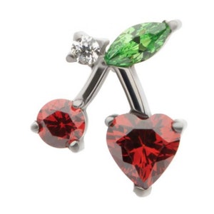 May include: A silver charm in the shape of a cherry with red and green crystal accents.