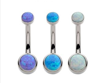 May include: Three belly button rings with different colored opal stones. The rings are made of surgical steel and have a curved barbell design. The stones are a light blue, a dark blue, and a white opal.