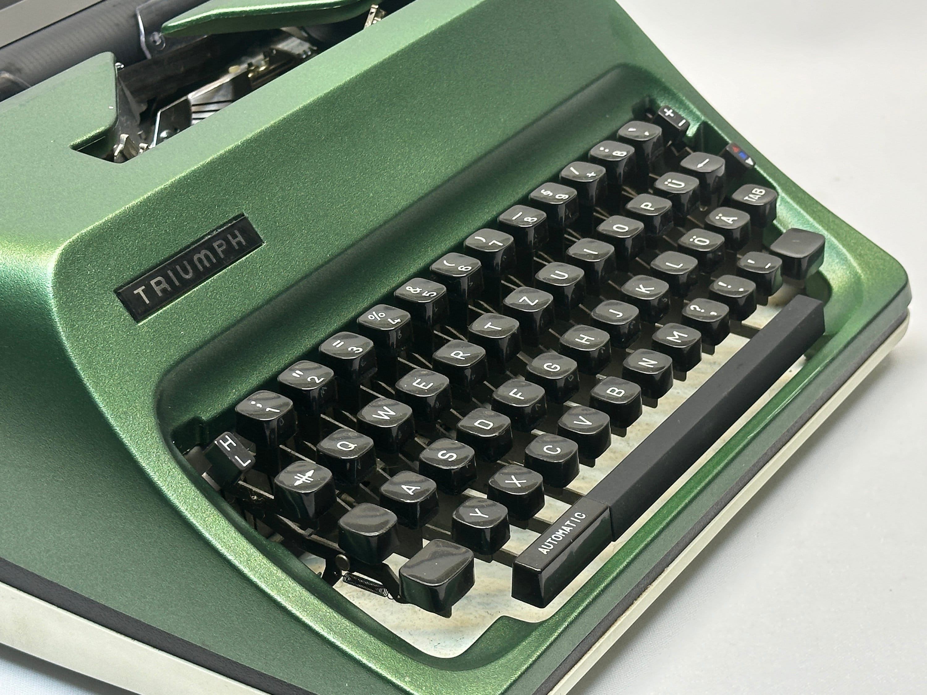 Triumph Adler Typewriter, Dark Green, QWERTZ Keyboard, With Bag