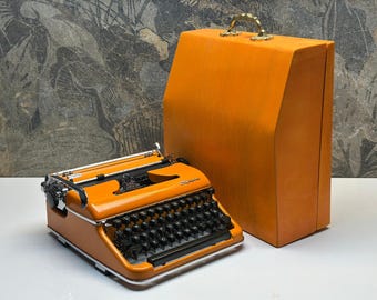 Olympia SM3 Orange Typewriter – Restored Vintage with Carrying Bag