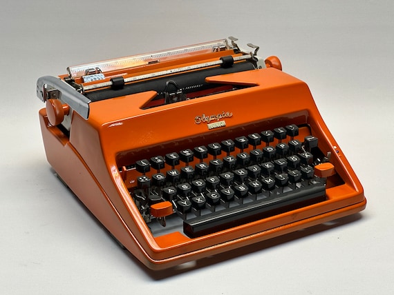 Vintage 1965 Olympia Monica Typewriter – Orange With Leather Bag