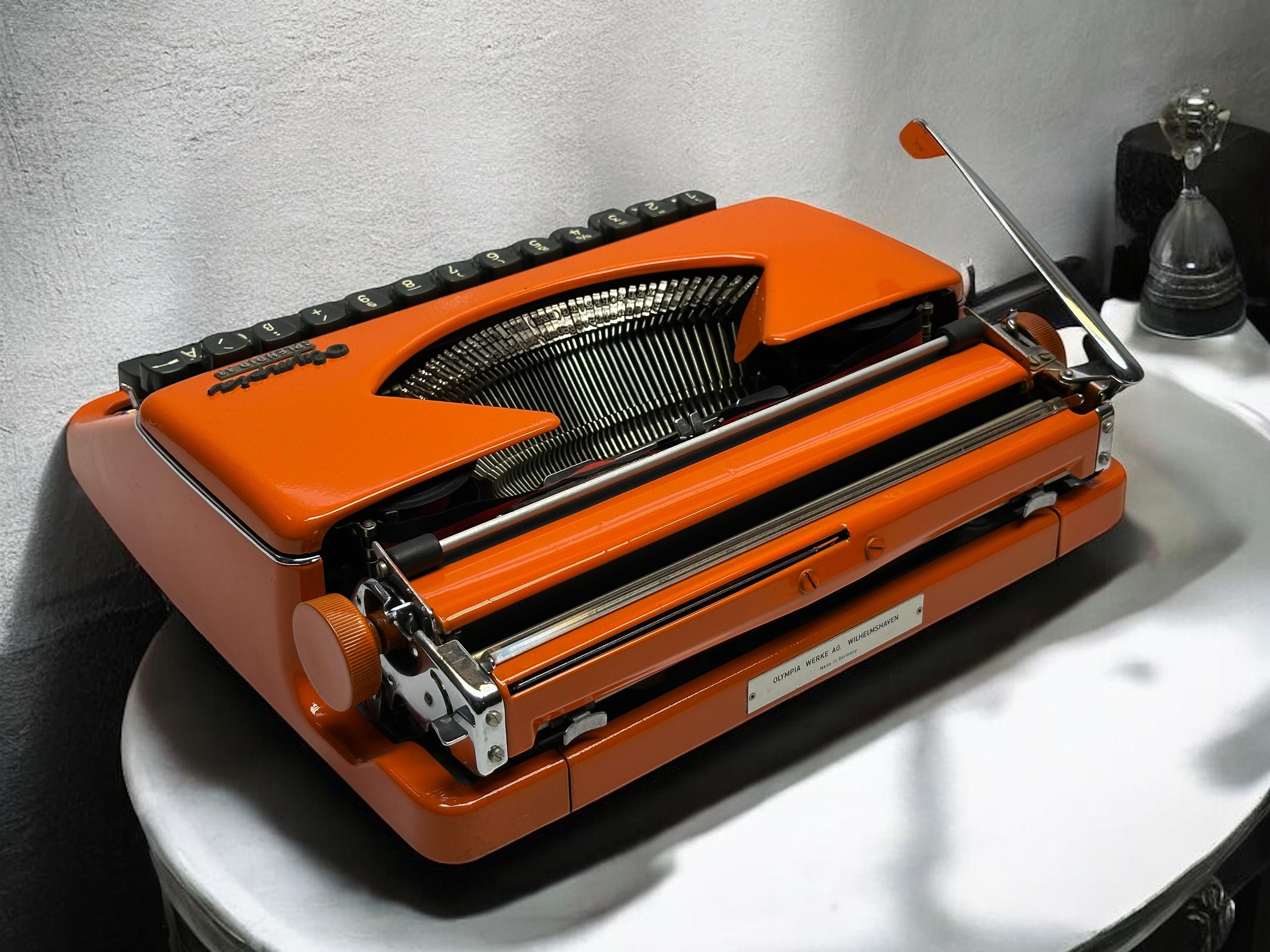 Vintage Orange Olympia Splendid 33 Typewriter – Retro Office Decor
