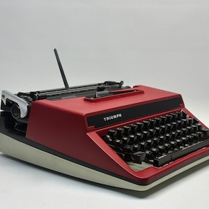 Unleash Creativity with the Red Triumph Typewriter - Vintage Charm, QWERTZ Keyboard, Antique Gift