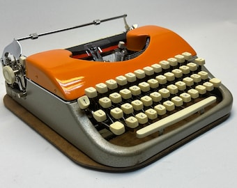 ¡Bonito regalo! Máquina de escribir Voss Orange: dije vintage con bolsa de cuero de 1960 y garantía original