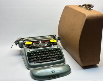 1958 Alpina SK24 Typewriter – Dark Blue, Black Keyboard, with Leather Bag