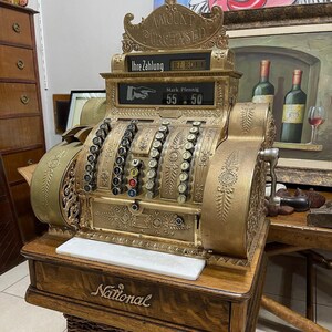 May include: A set of three ceramic mugs with a speckled, matte finish. The mugs are in shades of cream, light gray, and dark gray. Each mug has a simple, minimalist design, perfect for coffee or tea.