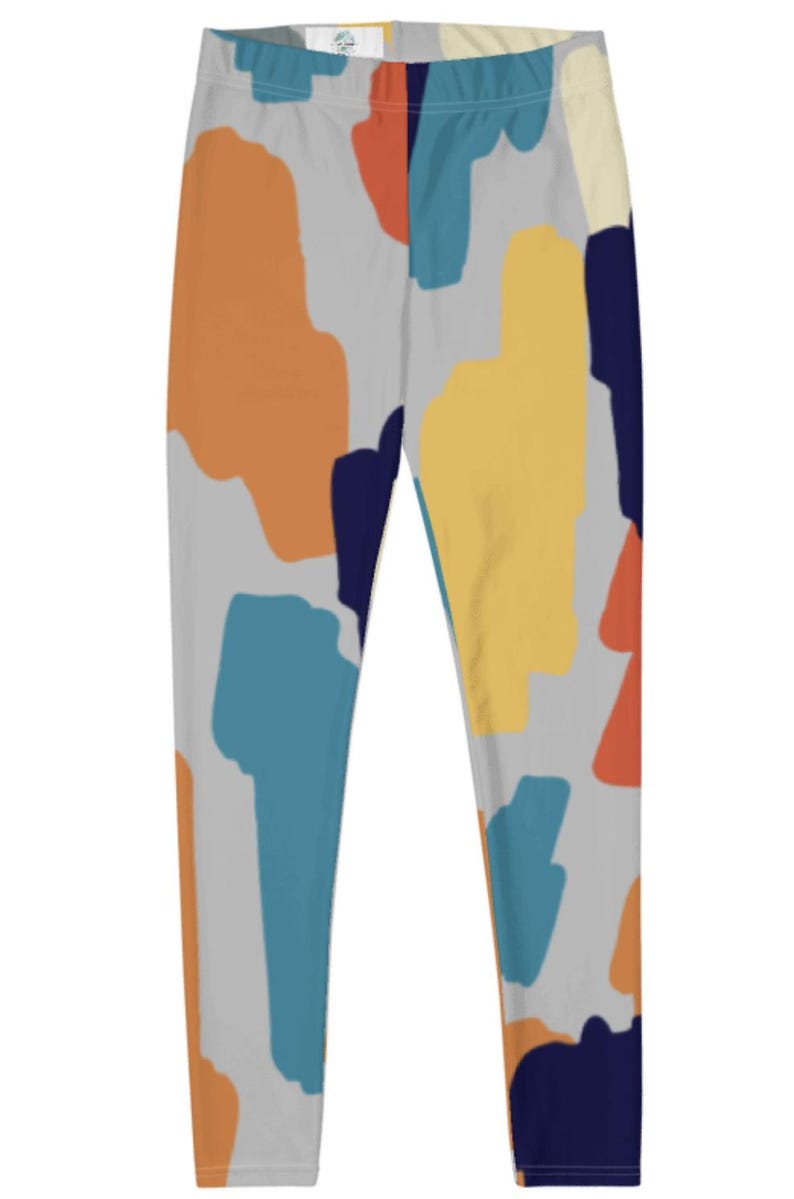 May include: Gray leggings with a colorful abstract print featuring shades of blue, orange, yellow, and red.