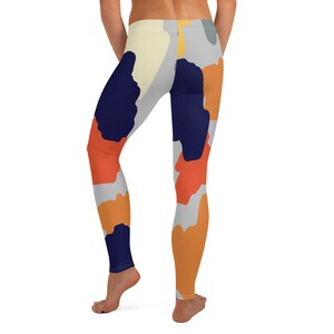 May include: A pair of leggings with a colorful abstract camouflage pattern. The leggings are made of a stretchy, comfortable fabric and feature a high waist.