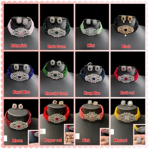 May include: A set of ten colorful beaded chokers with matching earrings. Each choker features a large, square-shaped pendant with a floral design and clear rhinestones. The colors include baby pink, dark green, mint, black, royal blue, emerald green, navy blue, dark red, maroon, pepper red, pink, and mustard.
