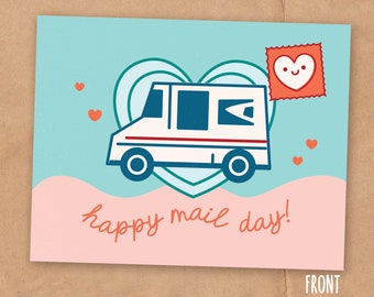 May include: A light blue card with a pink and white wave at the bottom. A white mail truck with a blue door and red stripe is driving through a green heart. A red heart with a smiling face is on top of the truck. The text "happy mail day!" is written in orange below the truck.