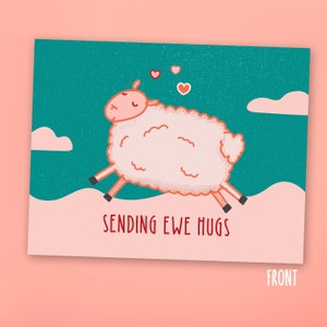 May include: A pink sheep with closed eyes and a happy expression jumps through the air with hearts floating above it. The background is a teal blue with white clouds. The text "Sending Ewe Hugs" is written below the sheep.