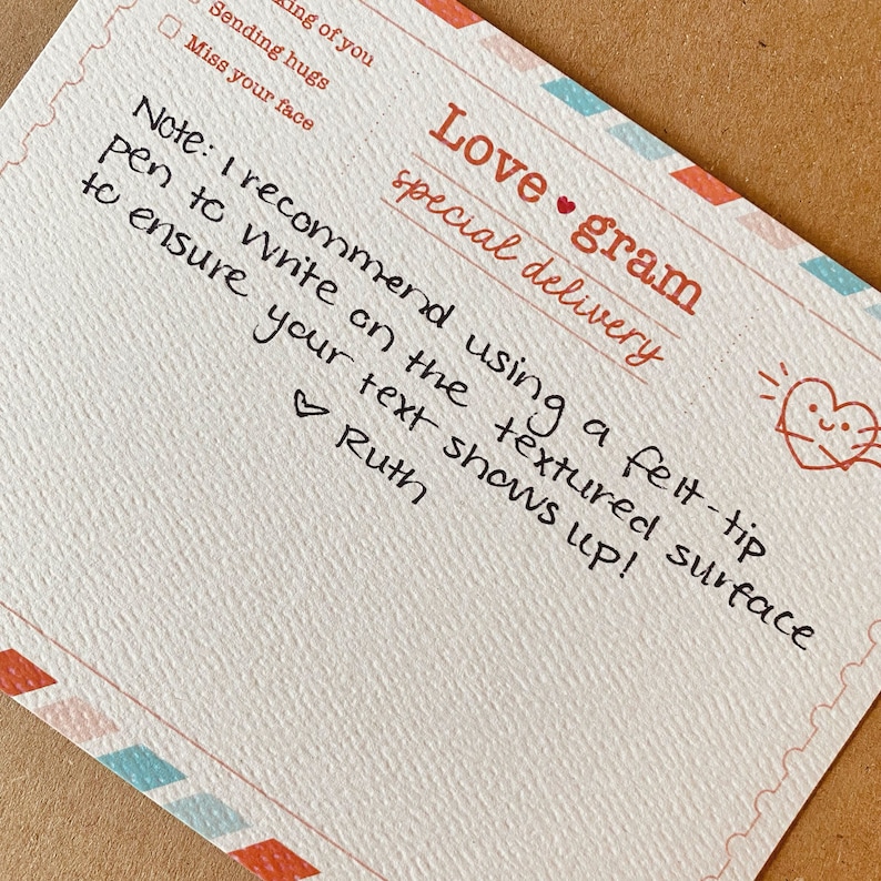 May include: A handwritten note on a textured card that says "Love gram special delivery". The note says "Note: I recommend using a felt-tip pen to write on the textured surface to ensure your text shows up! Ruth"