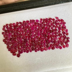 May include: A set of three ceramic mugs with a speckled, matte finish. The mugs are in shades of cream, light gray, and dark gray. Each mug has a simple, minimalist design and a rounded handle. The mugs are suitable for coffee, tea, or other beverages.