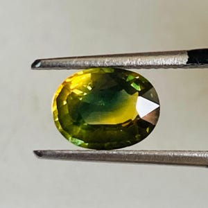 Natural parti sapphire, 9x6.70 mm parti sapphire Oval shape ,1 Piece Bi-Color Yellow , green, Blue , 2.10 carat/ Rare Parti Sapphire