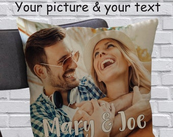 May include: A personalized pillow with a photo of a couple smiling and hugging. The text "Mary & Joe" is printed on the pillow in a white font.