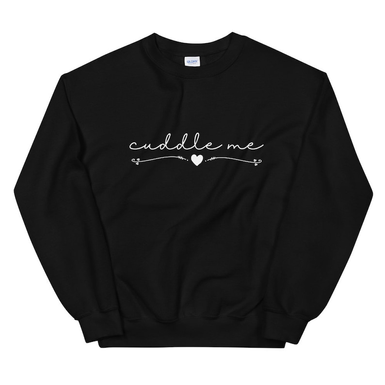 May include: Black sweatshirt with white text that says "cuddle me" with a small heart in the middle.