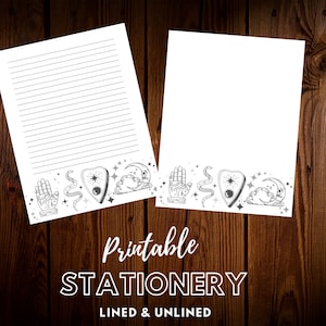 May include: Two sheets of white printable stationery, one lined and one blank, with a decorative border featuring a hand, snake, planchette, moon, and stars. The text "Printable STATIONERY LINED & UNLINED" is displayed.