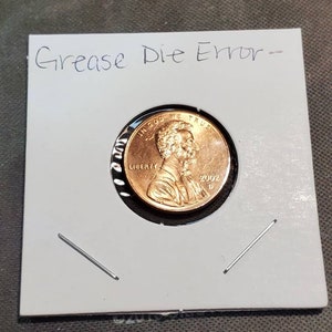 2002-D Die Chip/Struck Through/Plating Blister Error
