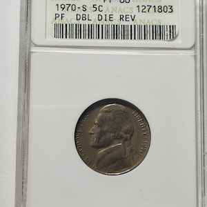 May include: A 1970-S 5c US coin graded by ANACS as PF66 with a double die reverse. The coin is encased in a clear plastic holder with a white label that reads "ANACS ANPF66 ANACS 1970-S 5C ANACS 1271803 PF DBL DIE REV ANACS".