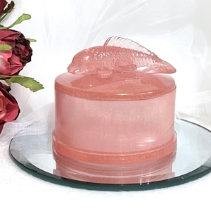 Circular light salmon color dish with lid to hold jewelry or trinkets / lid is accented with a Koi fish/ ring holder