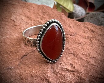 Carnelian and solid sterling silver ring. Hand hammered band.