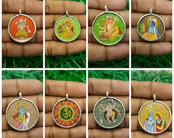 May include: Eight round silver pendants with colorful hand-painted images of Hindu deities and symbols. The pendants feature images of Krishna, Ganesha, Shiva, Radha Krishna, and the Om symbol.