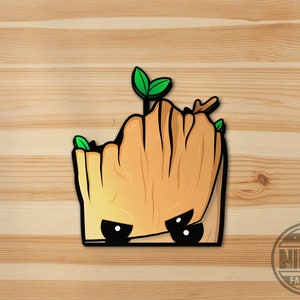 May include: A cartoon illustration of a brown and green tree character with a grumpy expression. The character has two small green leaves on top of its head and is looking directly at the viewer.