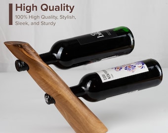 May include: A wooden wine rack with two bottles of wine. The rack is made of natural wood and has a sleek, modern design. The bottles are both red wine and have labels on them.