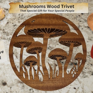 May include: A round wooden trivet with a mushroom design. The trivet is brown and has a cutout of mushrooms with stems and leaves. The text "Mushrooms Wood Trivet" is at the top of the image. The text "That Special Gift for Your Special People" is below the title. The text "Unique Decorative Practical" is on a white notecard in the lower left corner of the image.